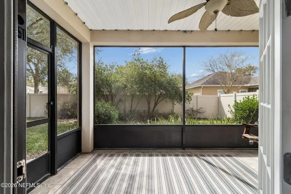 a room with a large window and a bed