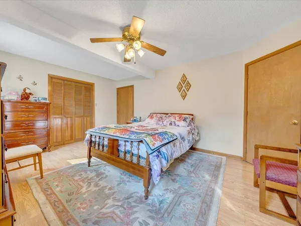 a bedroom with a bed and furniture