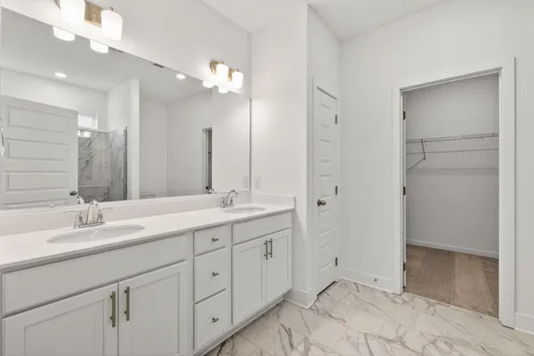 a bathroom with a glass shower door