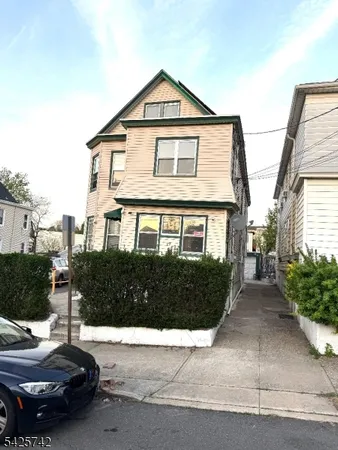 a front view of a house with yard