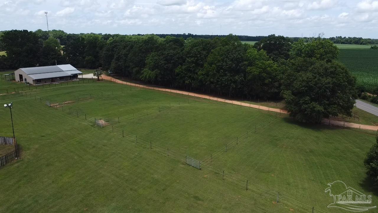 145 Tower Road Uriah, AL 36480 - Photo 65 of 72 a view of a green field with clear sky