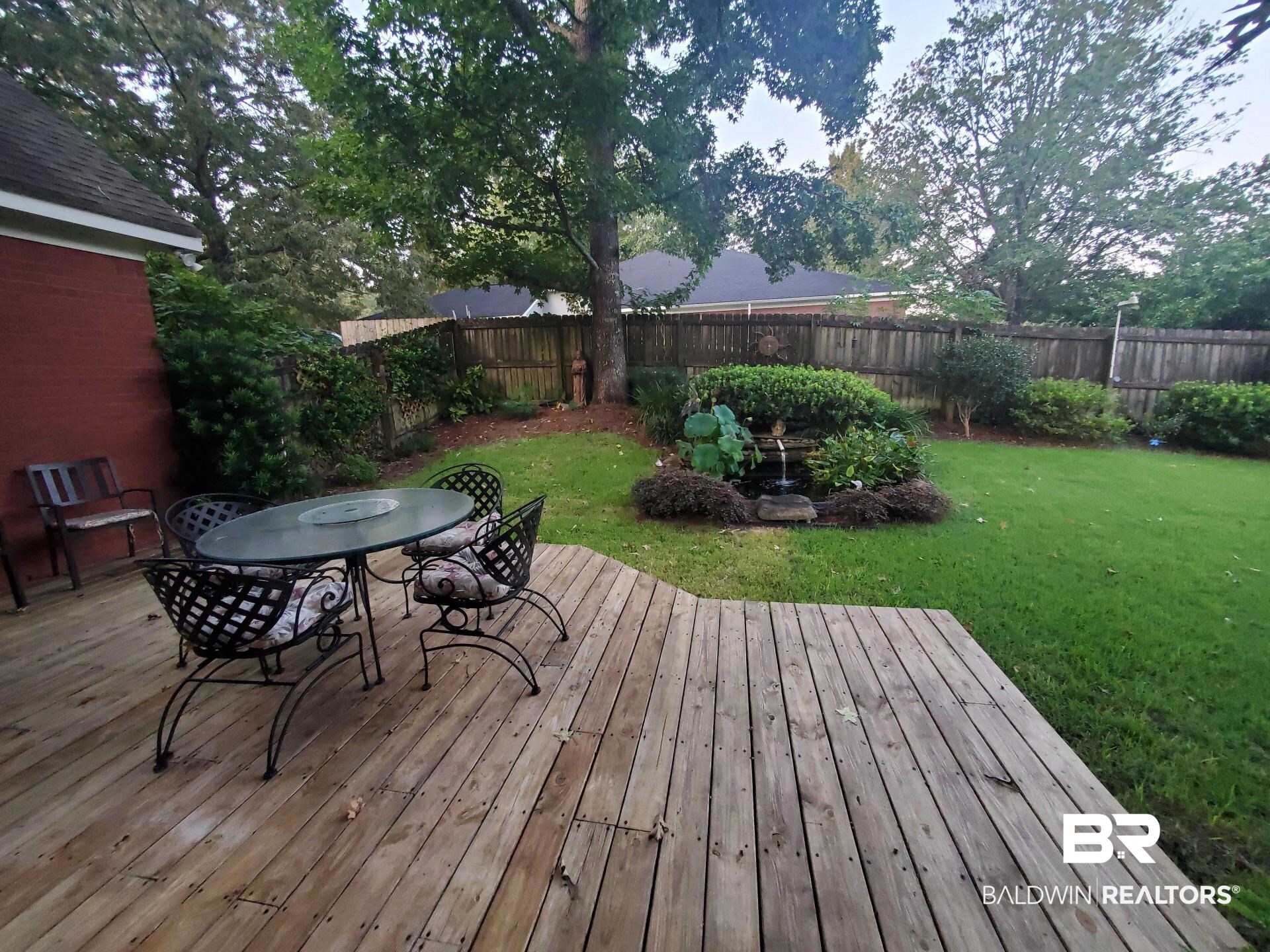 31163 Woodland Way Daphne, AL 36527 - Photo 44 of 44 Deck featuring a lawn