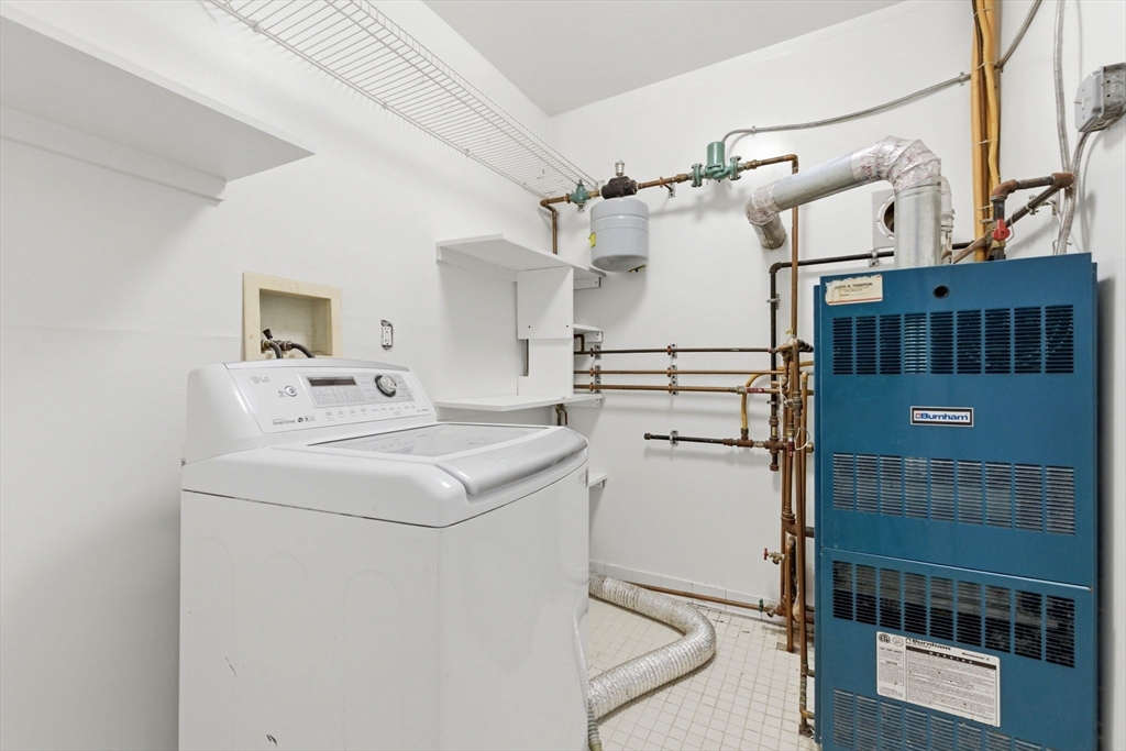 60 Tudor Street, Unit 1 Lynn, MA 01902 - Photo 12 of 19 a utility room with dryer and washer