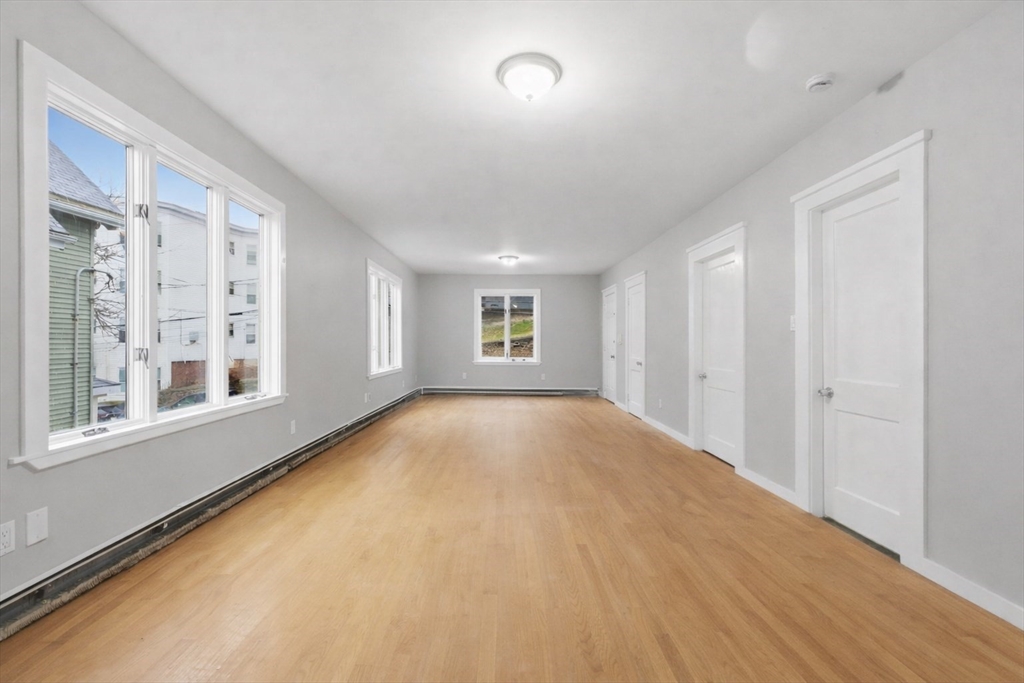 60 Tudor Street, Unit 1 Lynn, MA 01902 - Photo 7 of 19 a view of an empty room with a window