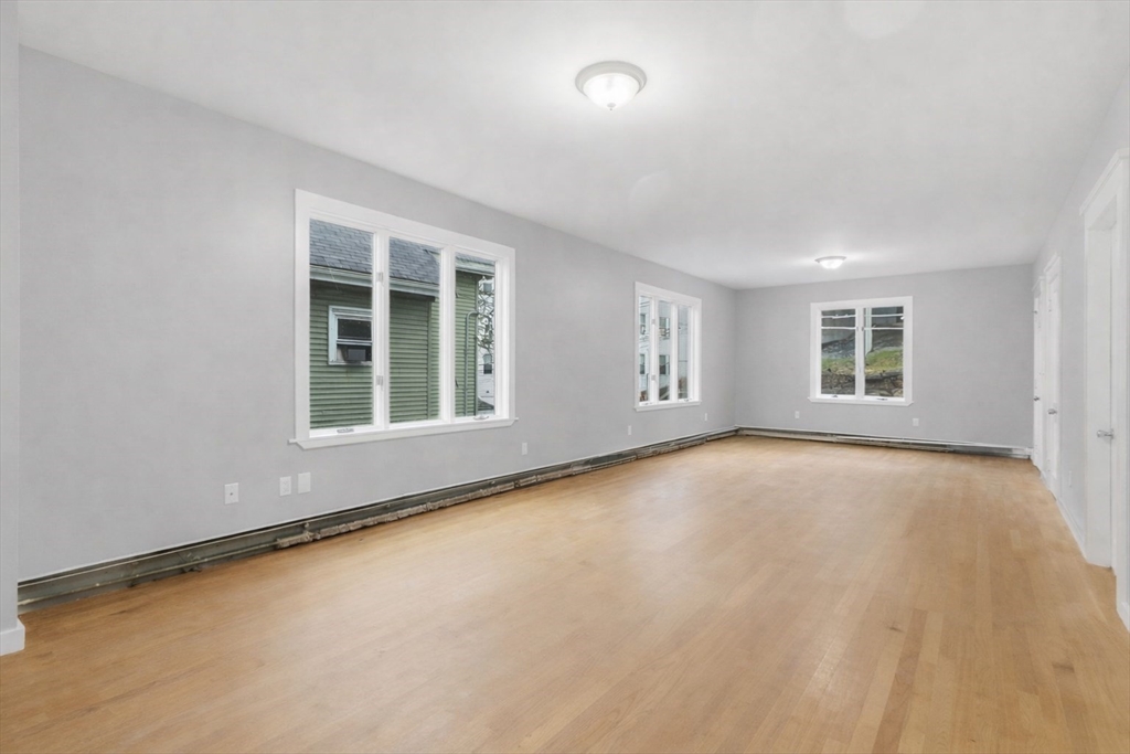 60 Tudor Street, Unit 1 Lynn, MA 01902 - Photo 8 of 19 a view of an empty room with a window
