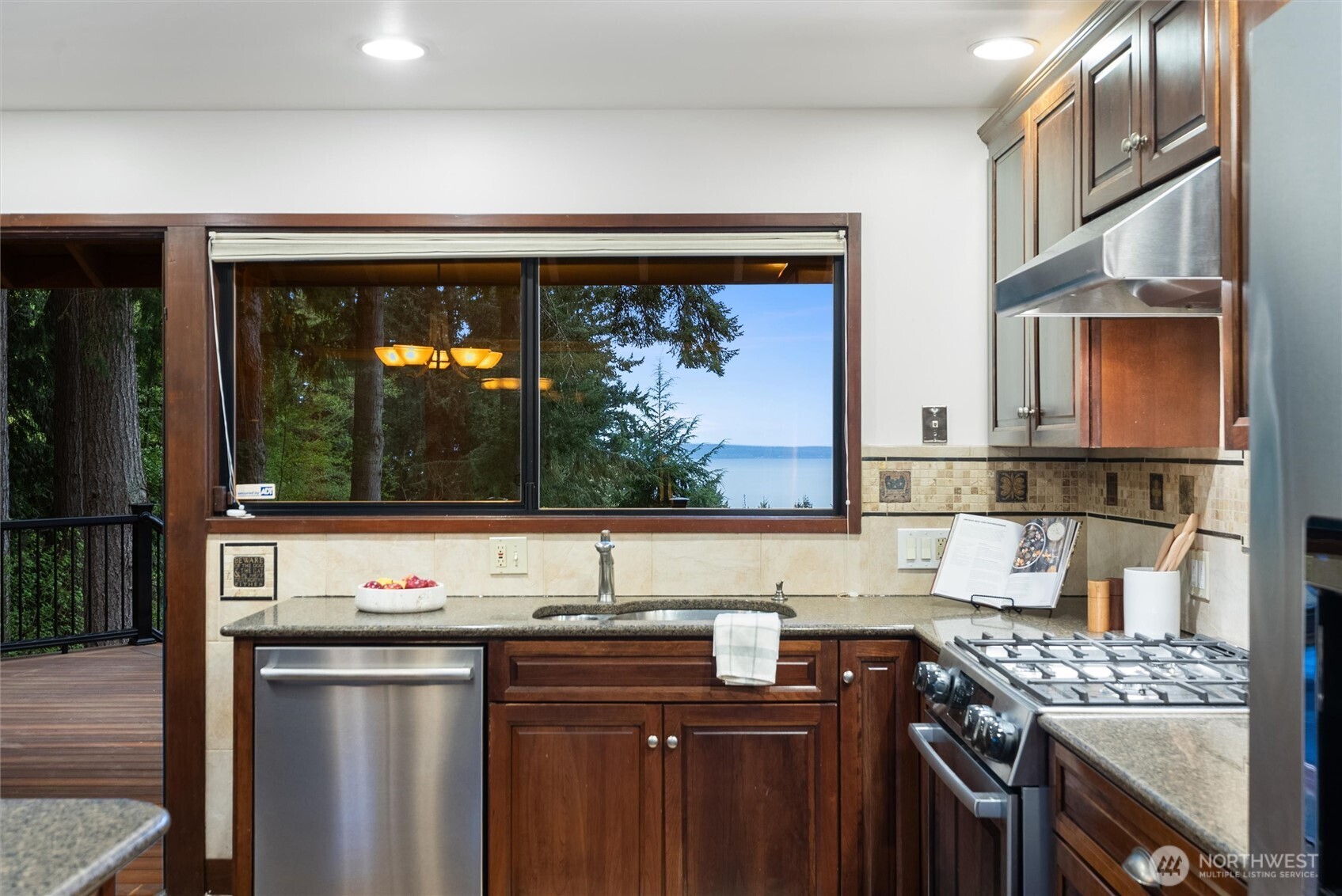 6920 160th Street Southwest Edmonds, WA 98026 - Photo 17 of 40 a kitchen with a sink stove and microwave