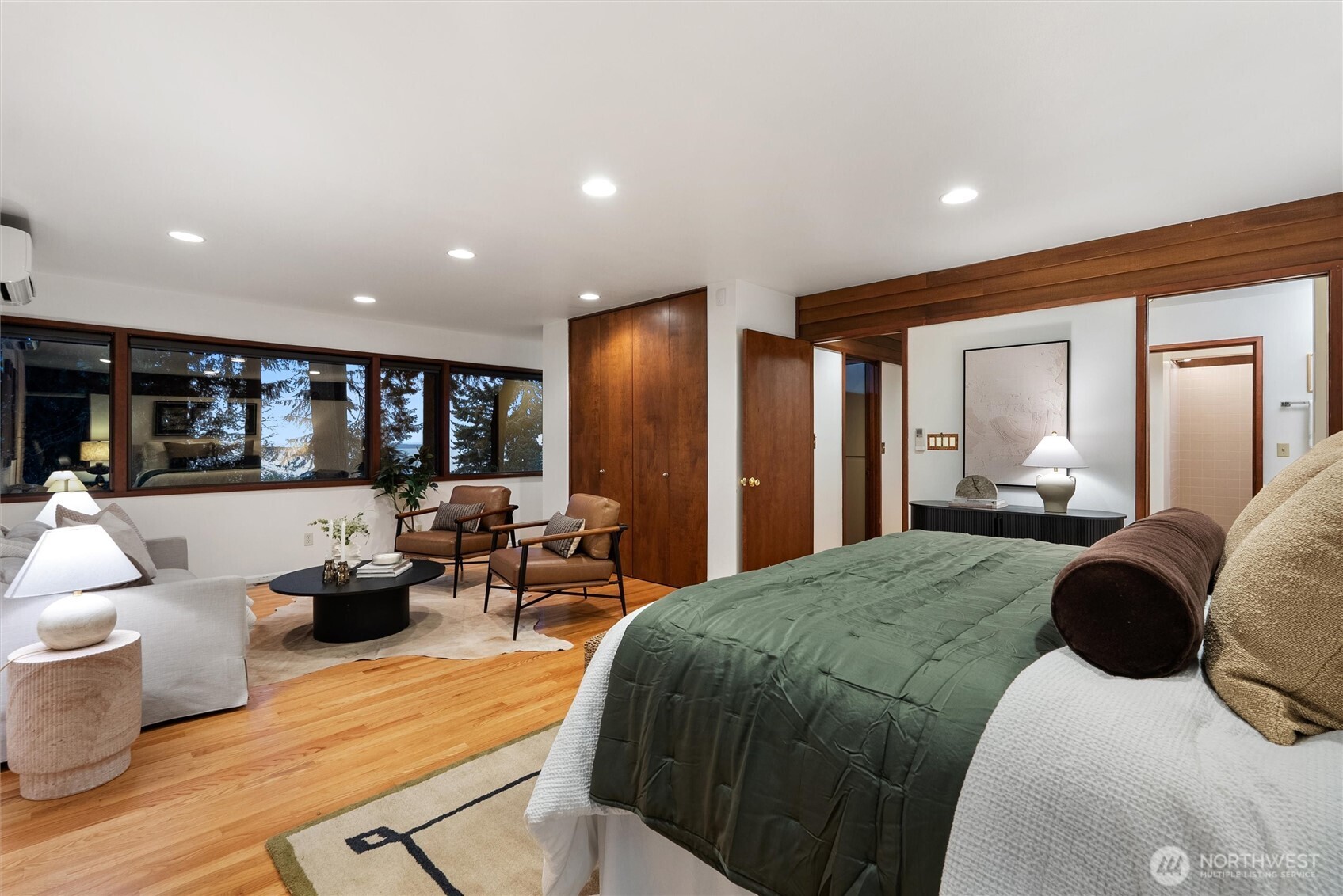 6920 160th Street Southwest Edmonds, WA 98026 - Photo 21 of 40 a bedroom with a large bed and glass windows