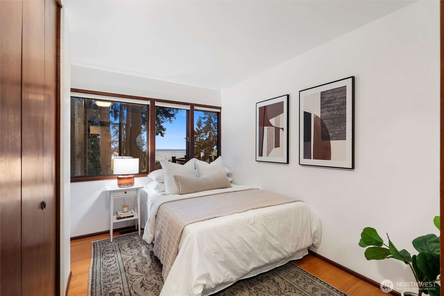 6920 160th Street Southwest Edmonds, WA 98026 - Photo 25 of 40 a bedroom with a bed and a painting on the wall