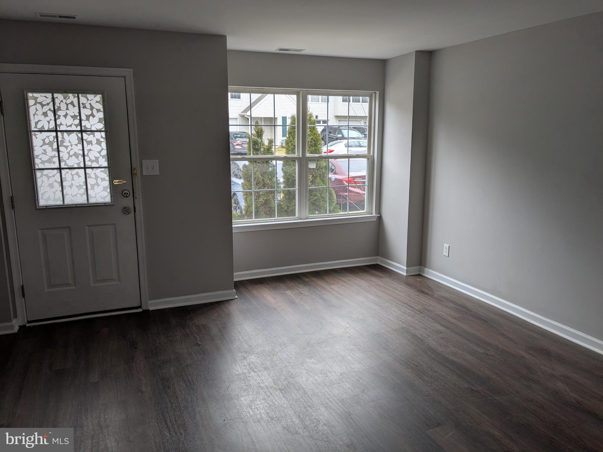 25 Millstream Road Pine Hill, NJ 08021 - Photo 11 of 28 an empty room with wooden floor and windows