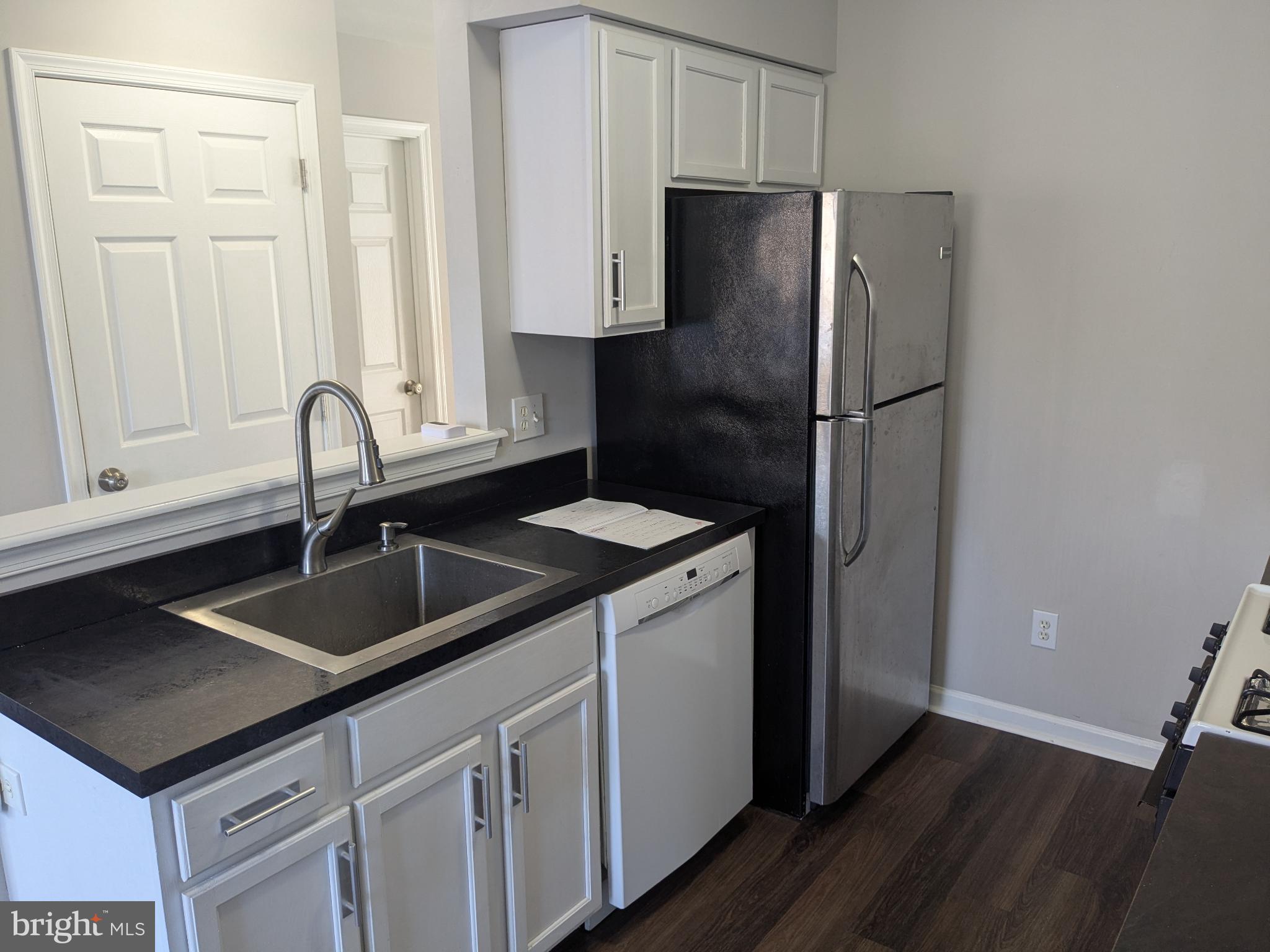 25 Millstream Road Pine Hill, NJ 08021 - Photo 5 of 28 a kitchen with stainless steel appliances granite countertop a refrigerator and a sink
