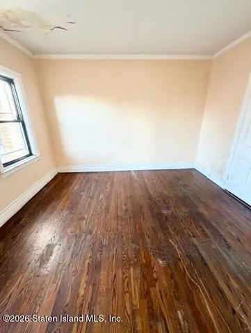 a kitchen with stainless steel appliances kitchen island granite countertop a refrigerator a stove a sink and dishwasher