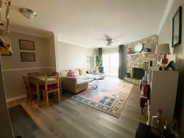 a living room with furniture fireplace and a flat screen tv