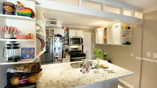 a living room with fireplace furniture and a flat screen tv