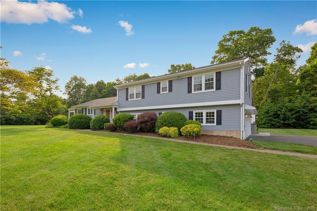 10 Devonshire Road Norwalk, CT 06850 - Photo 1 of 1 a front view of a house with a yard