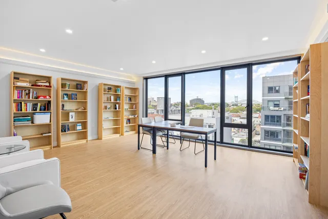 a room with gym equipment and a large window