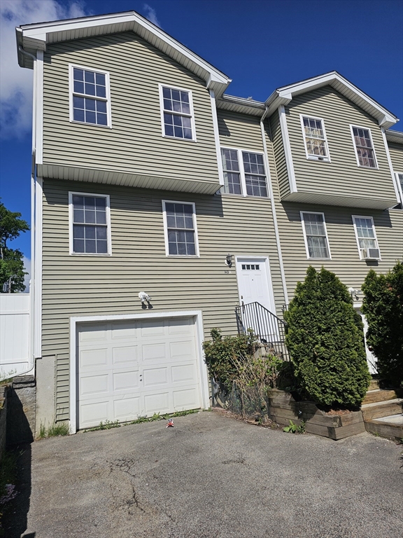 40 Merrick Street, Unit A Worcester, MA 01609 - Photo 1 of 32 a front view of a house with a yard