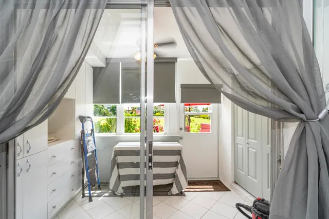 a view of a balcony with chairs