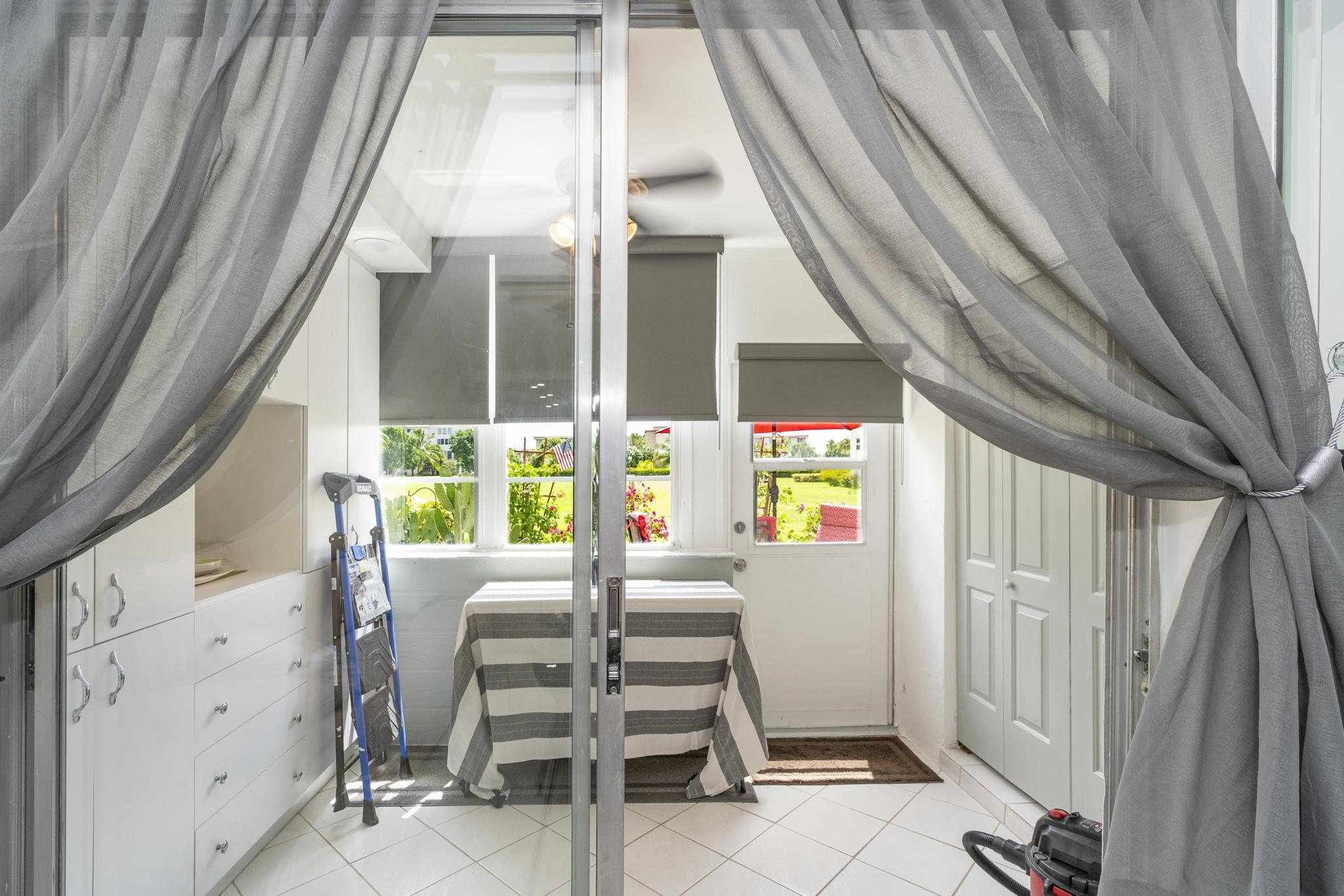 2600 Northeast 1st Lane, Unit 104 Boynton Beach, FL 33435 - Photo 14 of 41 a view of a balcony with chairs