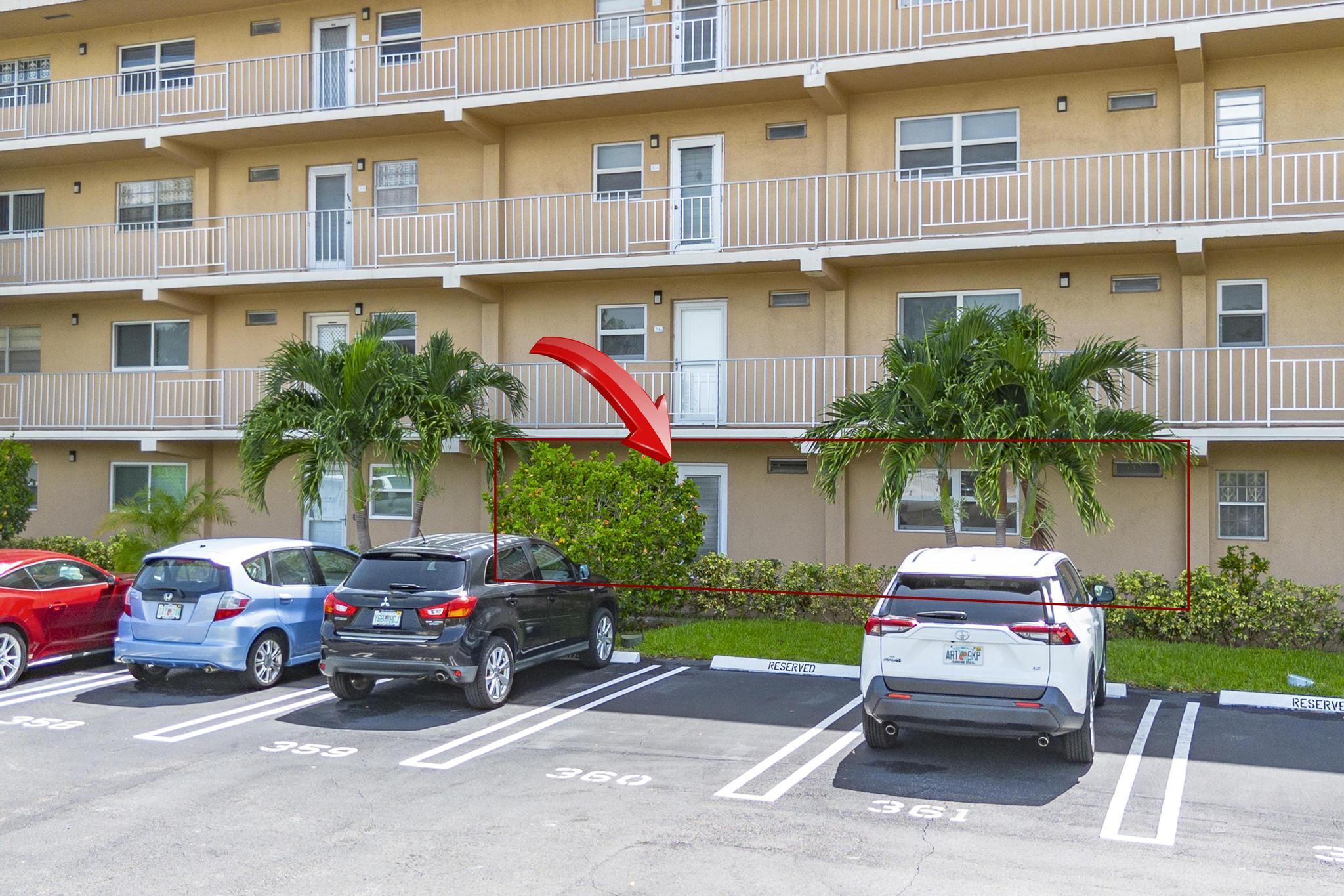 2600 Northeast 1st Lane, Unit 104 Boynton Beach, FL 33435 - Photo 33 of 41 a car parked in front of a building