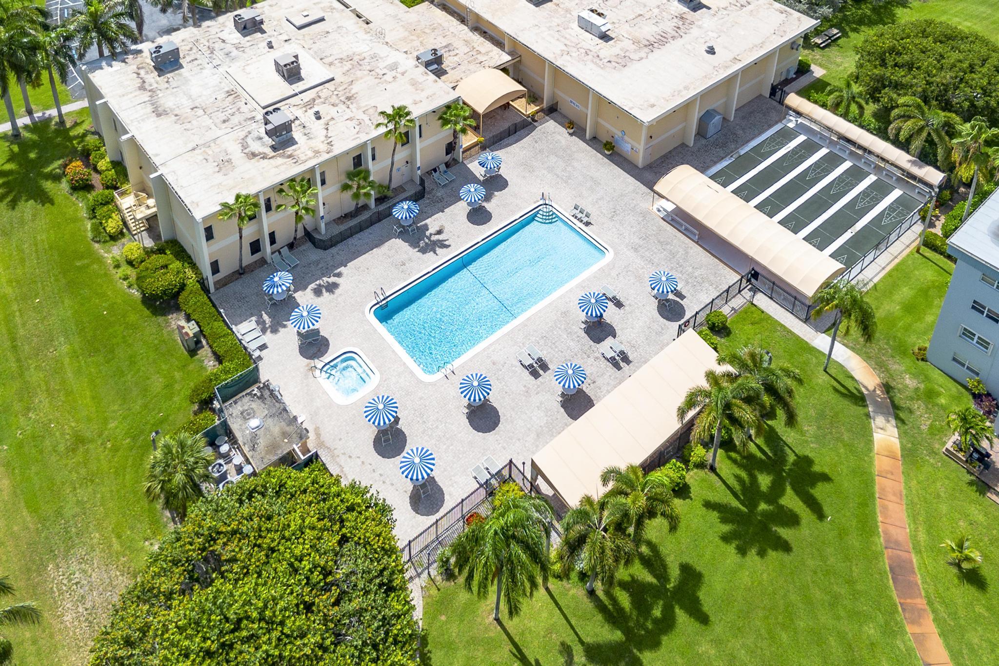 2600 Northeast 1st Lane, Unit 104 Boynton Beach, FL 33435 - Photo 35 of 41 an aerial view of a house with a yard and trees