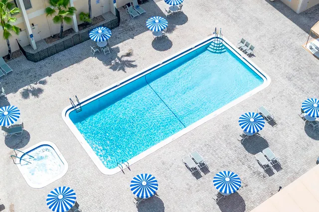 an aerial view of a house with a garden