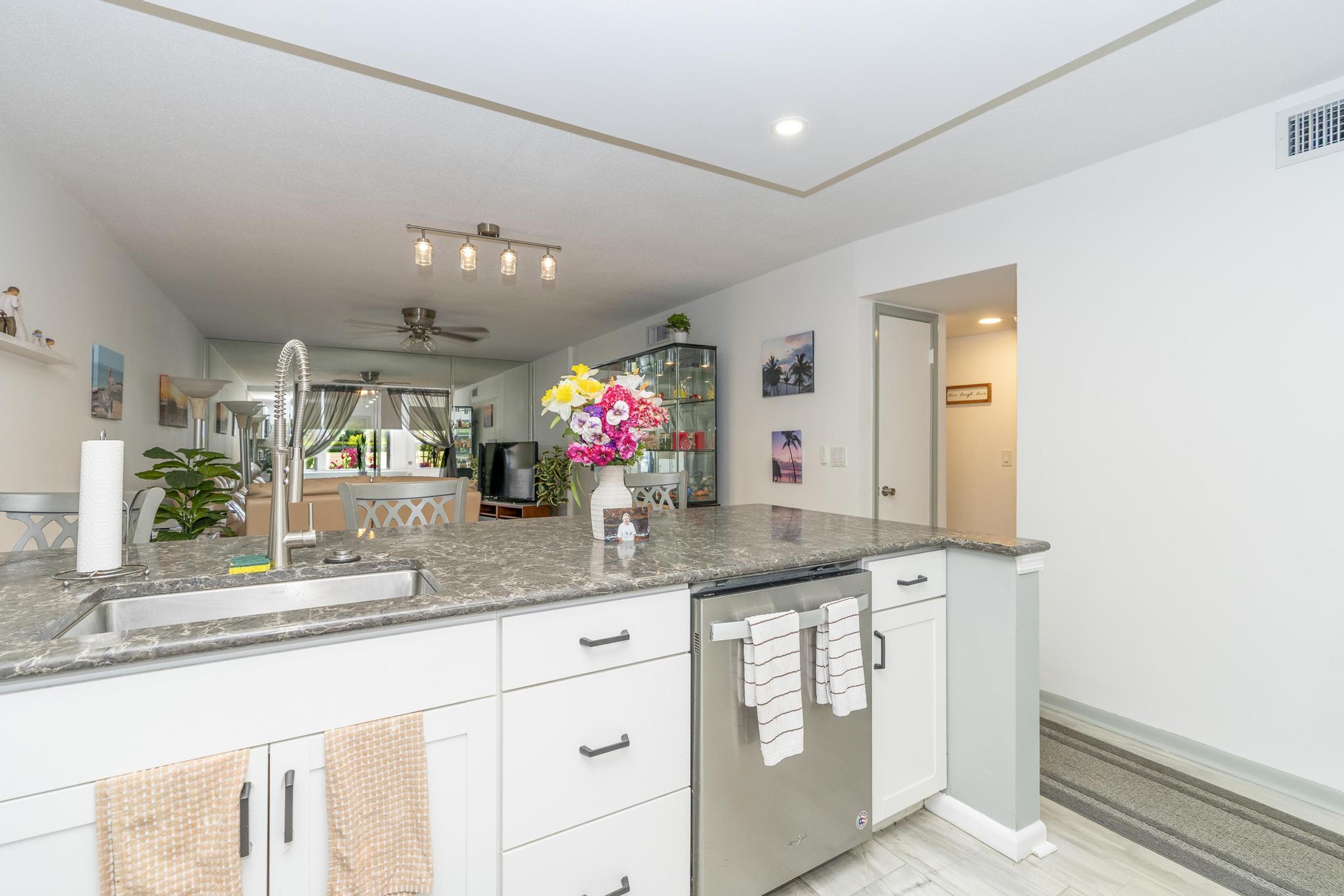 2600 Northeast 1st Lane, Unit 104 Boynton Beach, FL 33435 - Photo 5 of 41 a bathroom with a sink and a mirror