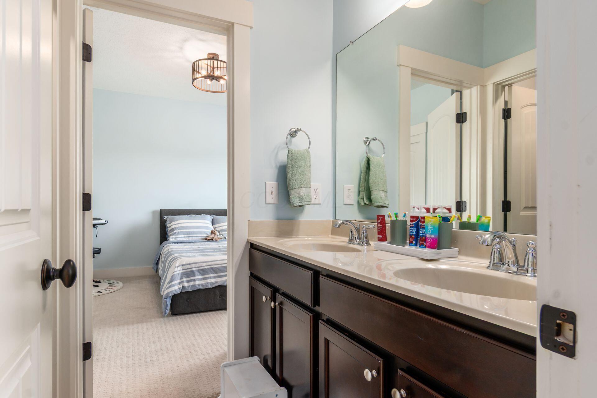 1002 Rambling Brook Way Delaware, OH 43015 - Photo 45 of 104 Jack and Jill bathroom between bedrooms two and three with glass door tub/shower and double vanity.