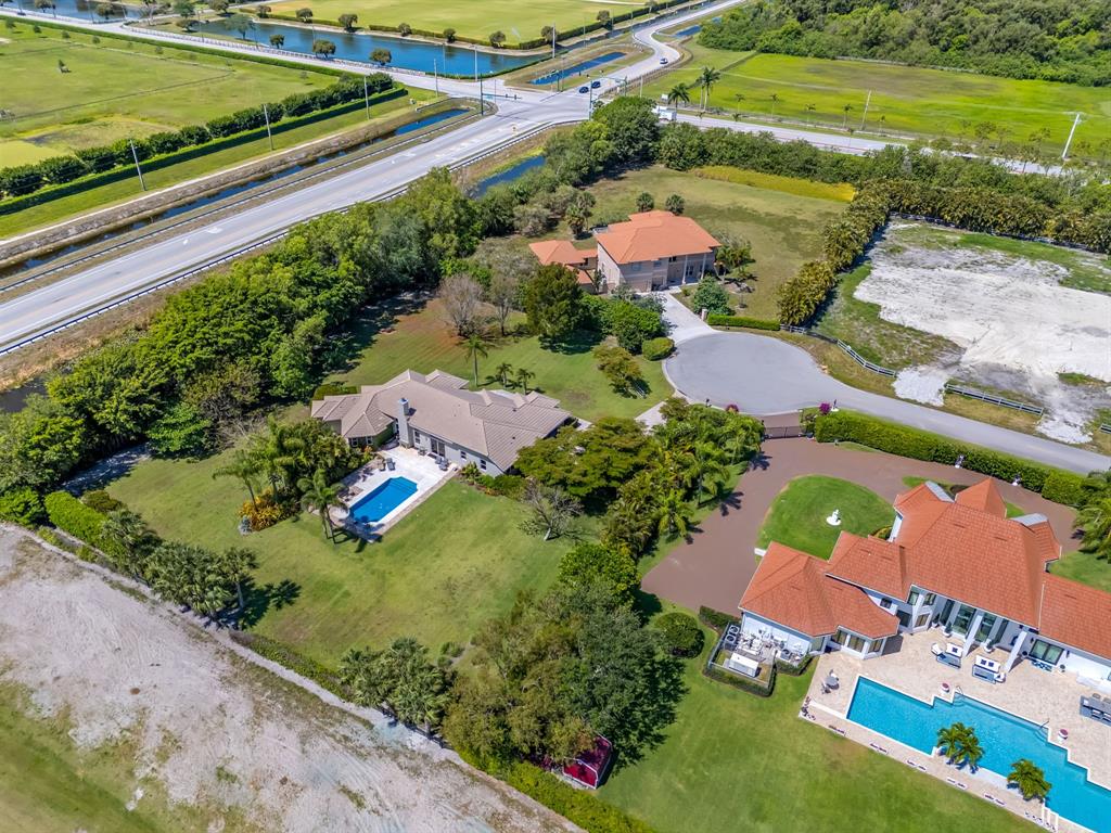 3950 Fieldview Way Wellington, FL 33414 - Photo 12 of 29 an aerial view of a house with a garden