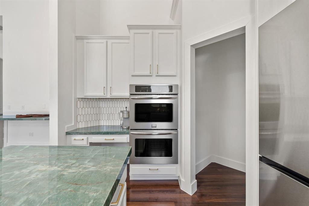 3950 Fieldview Way Wellington, FL 33414 - Photo 14 of 29 a kitchen with stainless steel appliances a stove a microwave and a refrigerator