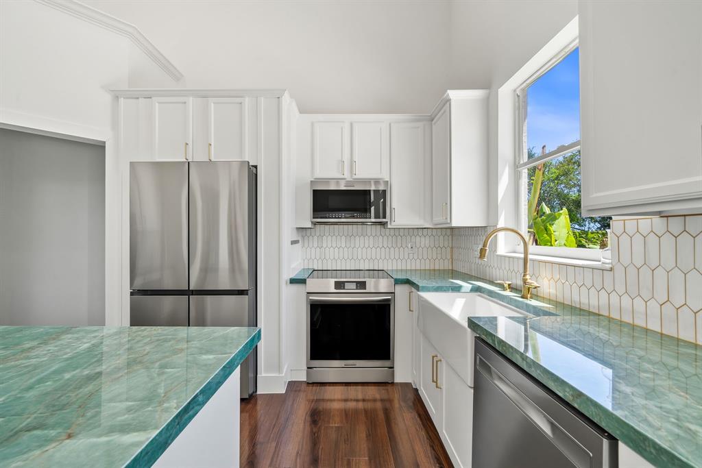 3950 Fieldview Way Wellington, FL 33414 - Photo 17 of 29 a kitchen with a sink stove and refrigerator