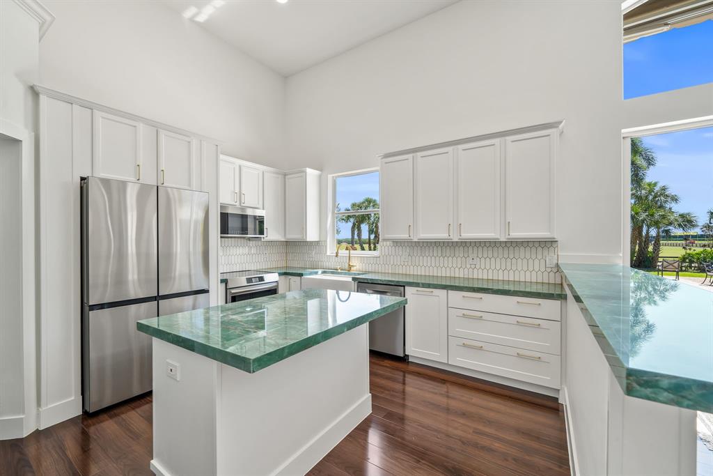 3950 Fieldview Way Wellington, FL 33414 - Photo 18 of 29 a kitchen with stainless steel appliances granite countertop a refrigerator sink and stove