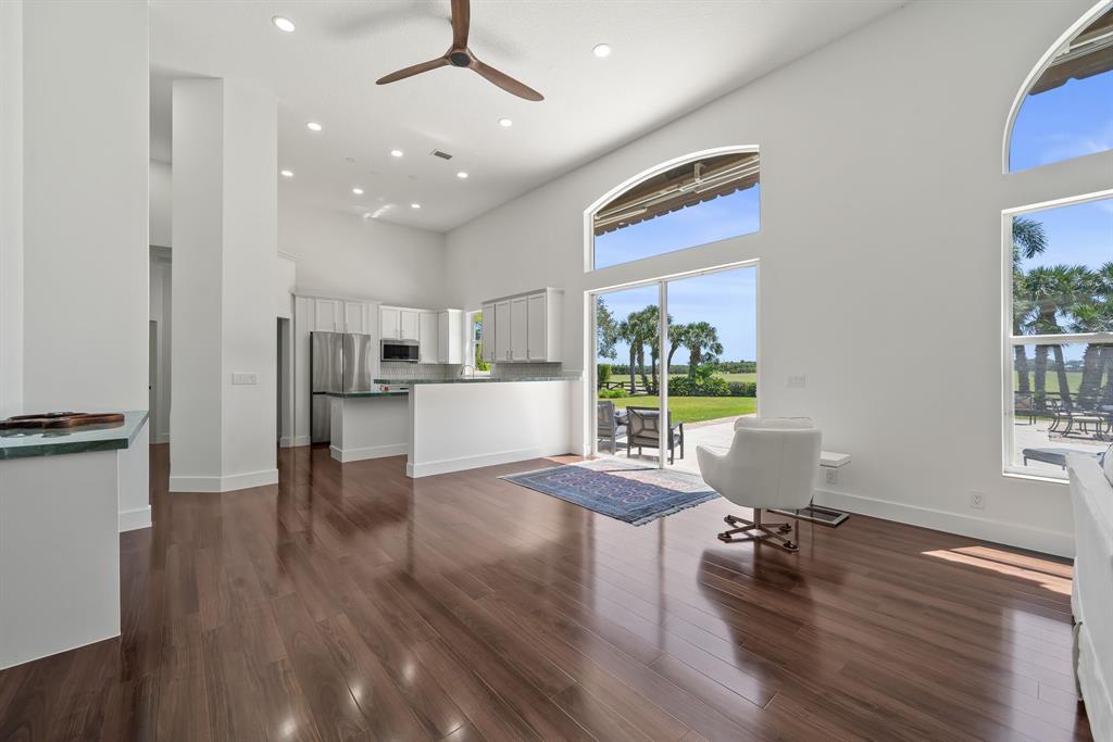 3950 Fieldview Way Wellington, FL 33414 - Photo 21 of 29 a living room with furniture and a wooden floor