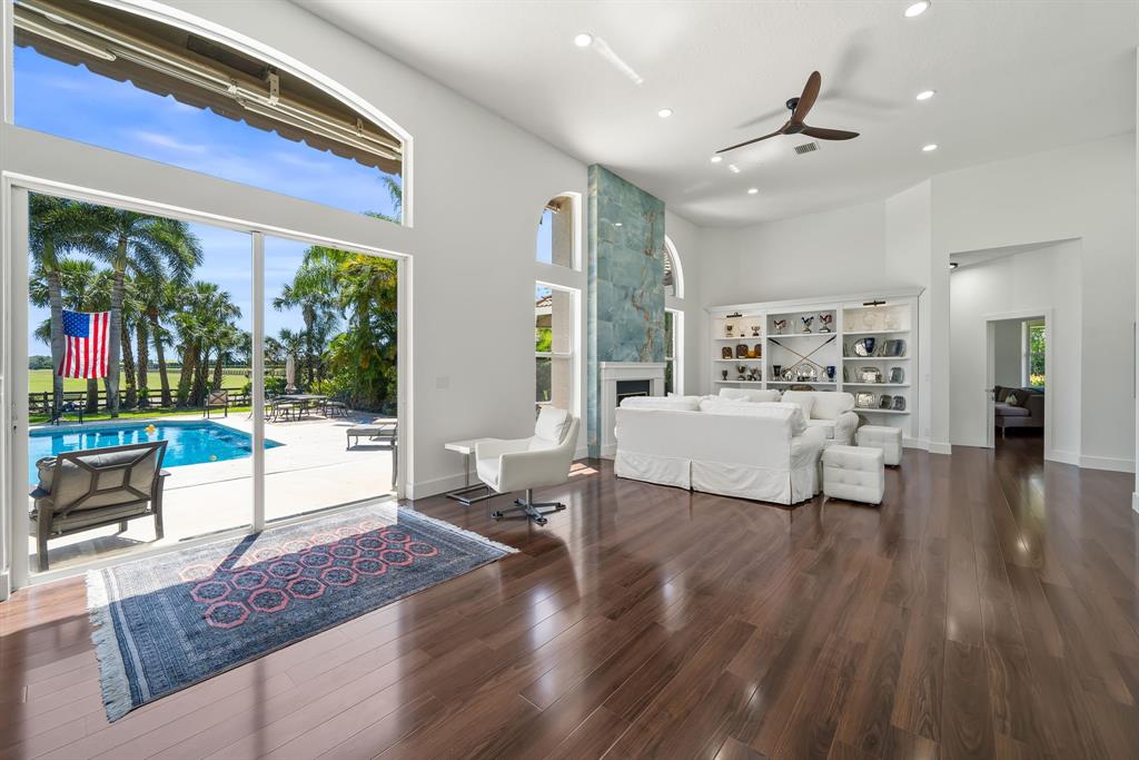 3950 Fieldview Way Wellington, FL 33414 - Photo 22 of 29 a living room with furniture and a wooden floor
