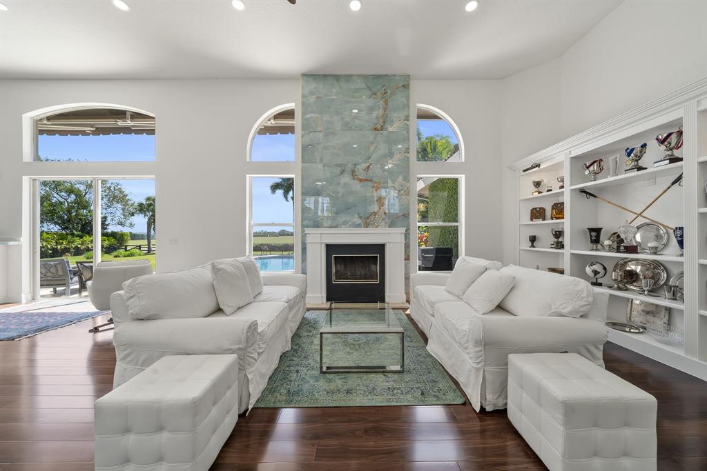 3950 Fieldview Way Wellington, FL 33414 - Photo 24 of 29 a living room with furniture and a fireplace