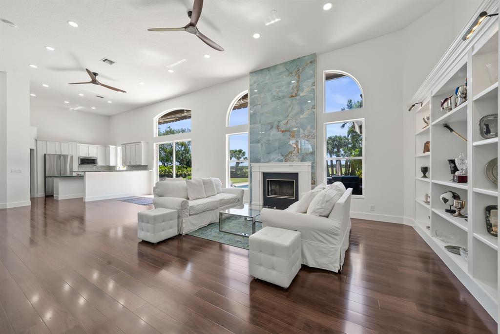 3950 Fieldview Way Wellington, FL 33414 - Photo 25 of 29 a living room with furniture or wooden floor and a fireplace