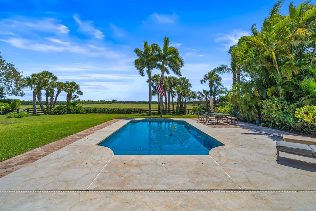 3950 Fieldview Way Wellington, FL 33414 - Photo 3 of 29 a view of swimming pool with a yard