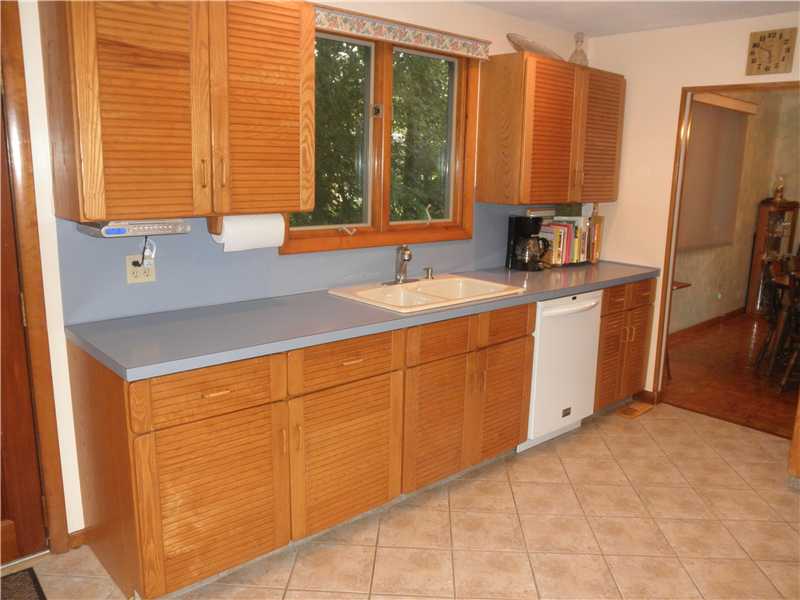 183 Ridge Road Smithfield, RI 02917 - Photo 3 of 23 Kitchen. This is a Very Deceiving Kitchen - The Kitchen & Dining Area is Spacious & There are Many Cabinets! One Side of Kitchen...