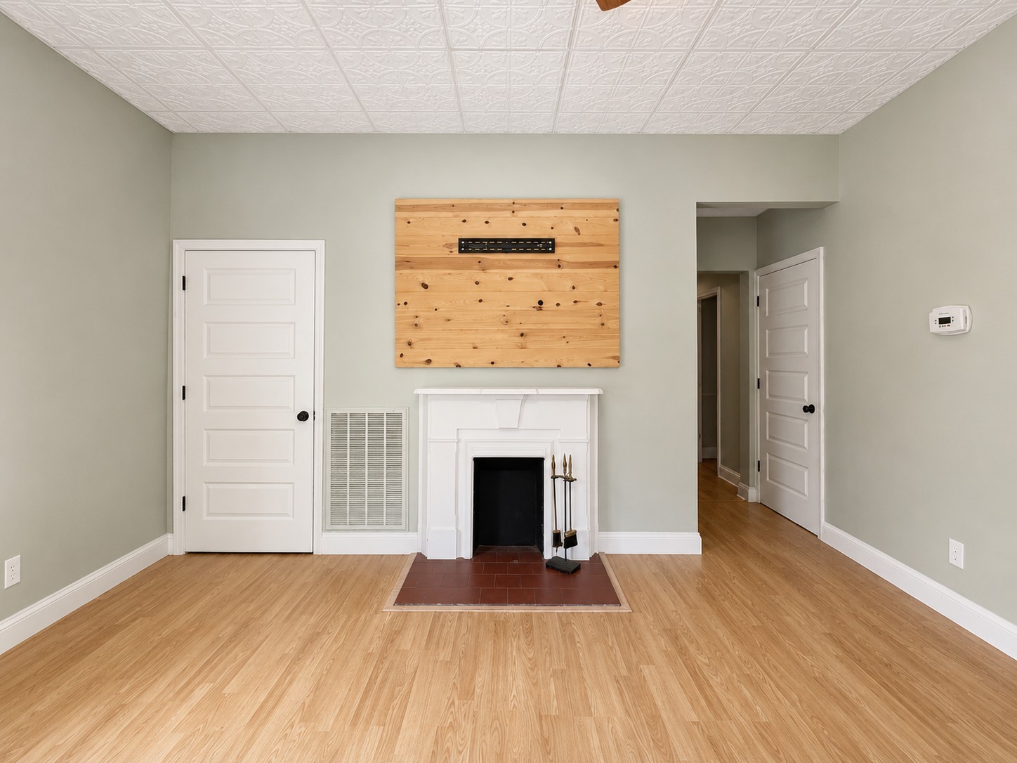 352 Main Street Cerulean, KY 42215 - Photo 13 of 32 a view of an empty room with wooden floor fireplace and a window