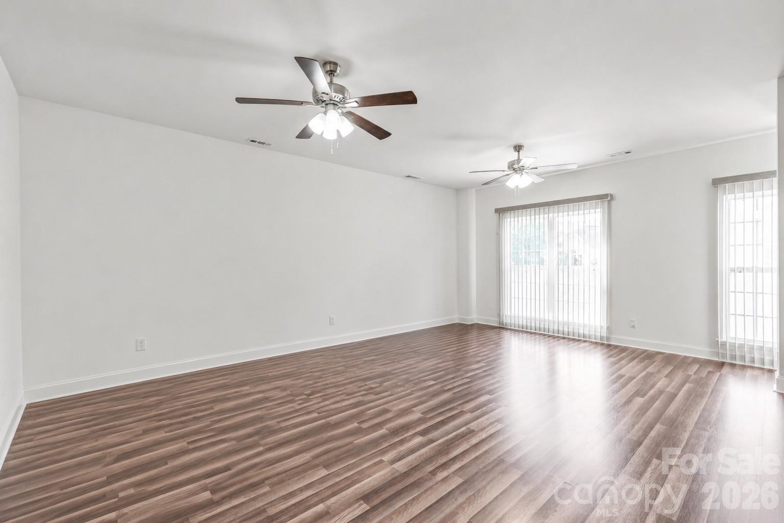 1707 Kashmir White Lane Fort Mill, SC 29708 - Photo 15 of 33 a view of an empty room with wooden floor and a window