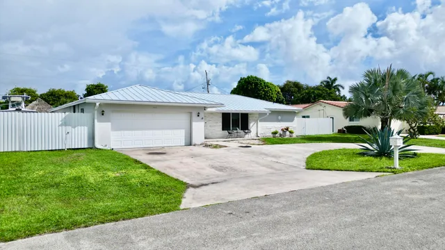 $825,000 | 1861 Caribbean Road West, Lake Clarke Shores, FL 33406