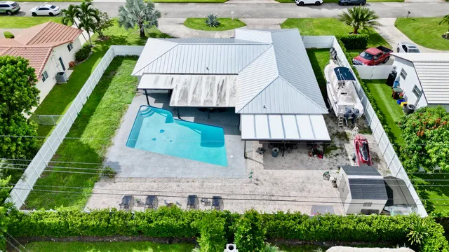 $825,000 | 1861 Caribbean Road West, Lake Clarke Shores, FL 33406