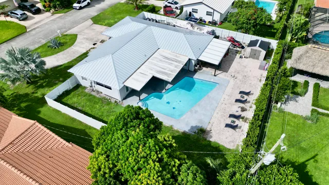 $825,000 | 1861 Caribbean Road West, Lake Clarke Shores, FL 33406
