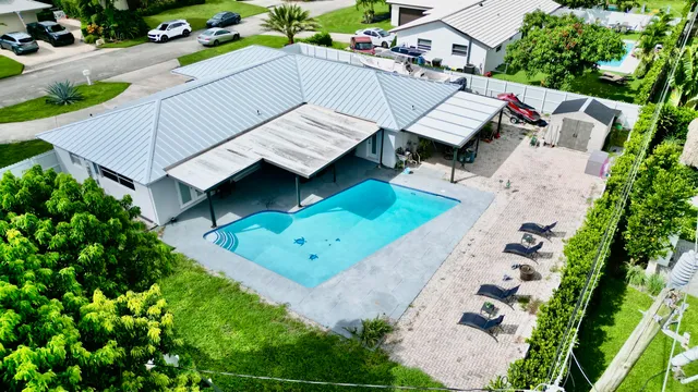 $825,000 | 1861 Caribbean Road West, Lake Clarke Shores, FL 33406