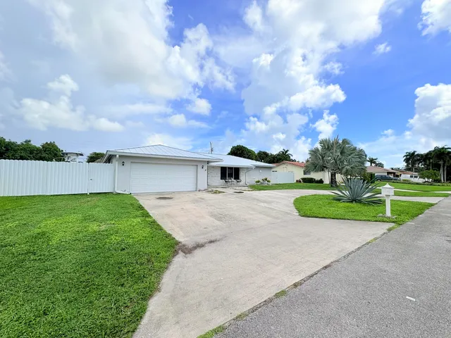 $825,000 | 1861 Caribbean Road West, Lake Clarke Shores, FL 33406
