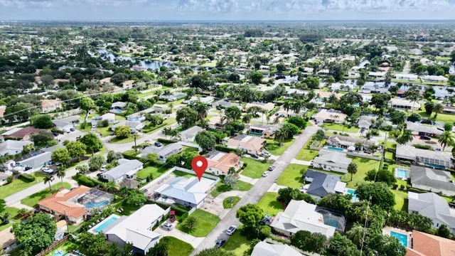 $825,000 | 1861 Caribbean Road West, Lake Clarke Shores, FL 33406