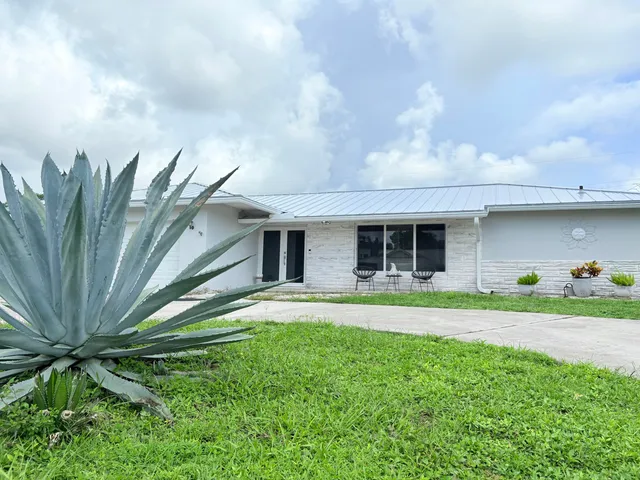 $825,000 | 1861 Caribbean Road West, Lake Clarke Shores, FL 33406