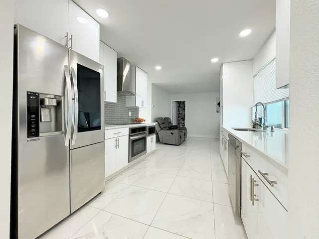 $825,000 | 1861 Caribbean Road West, Lake Clarke Shores, FL 33406