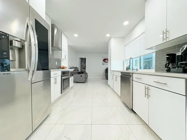 $825,000 | 1861 Caribbean Road West, Lake Clarke Shores, FL 33406