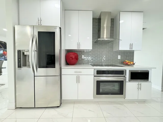 $825,000 | 1861 Caribbean Road West, Lake Clarke Shores, FL 33406