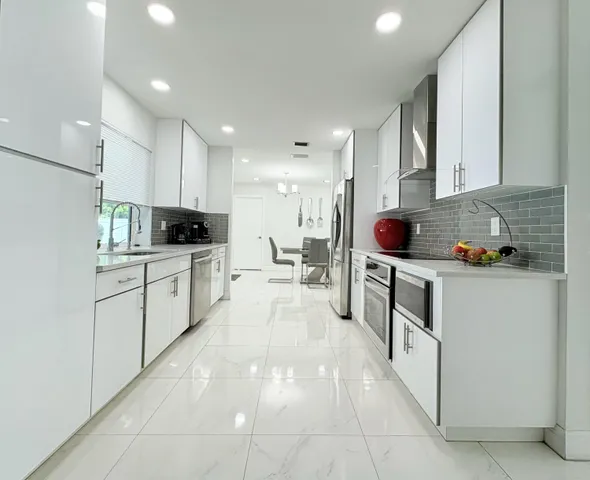 $825,000 | 1861 Caribbean Road West, Lake Clarke Shores, FL 33406